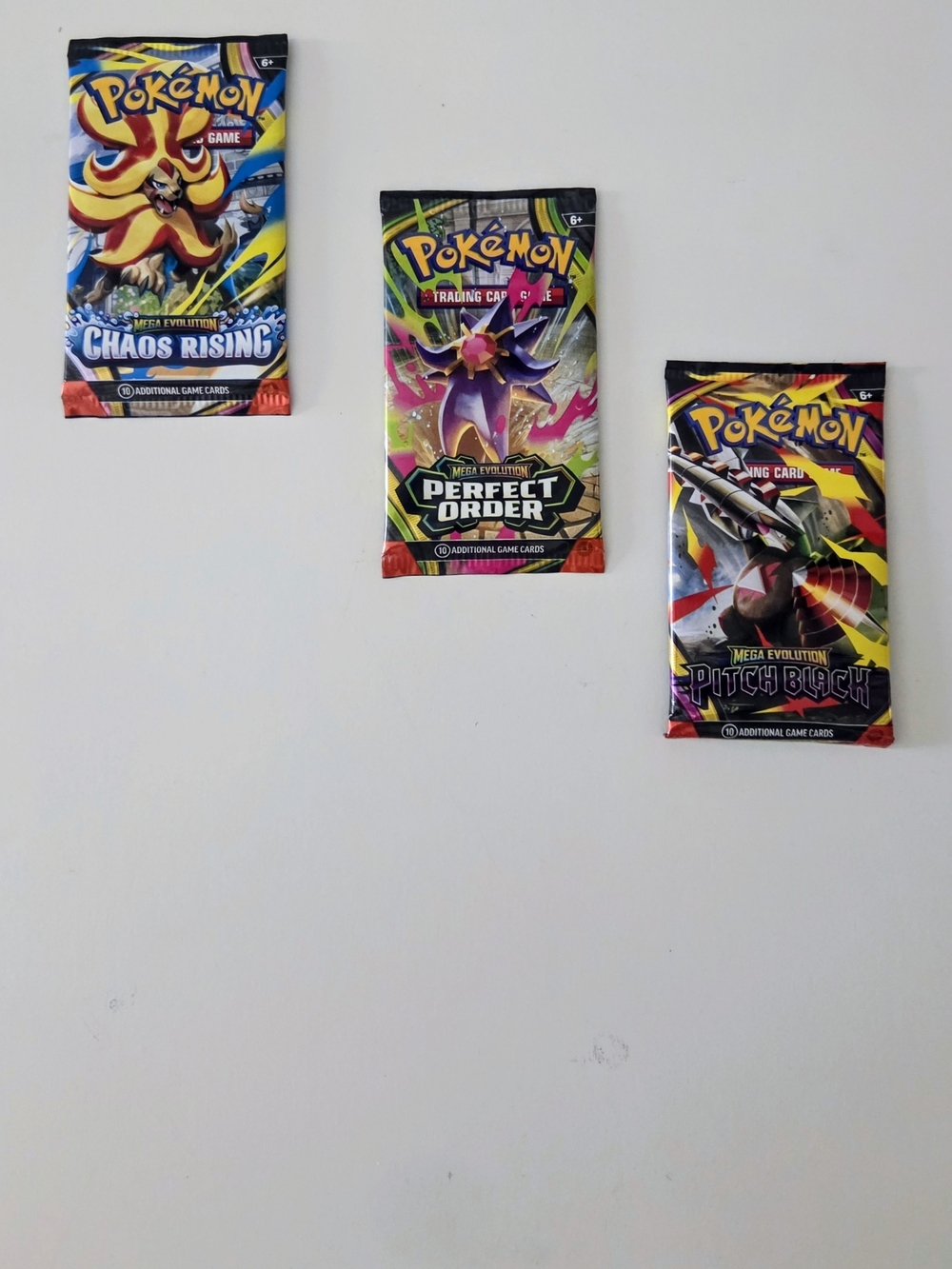 Pokémon Mega Evolution - Chaos Rising, Perfect Order & Pitch Black Booster Packs
